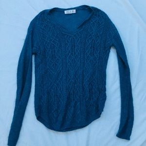 Blue knit sweater.